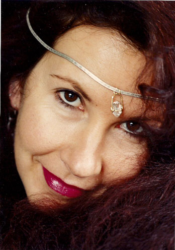 Beyond Tarot And More offering psychic reading near me in Spokane WA, holding a crystal ball in a spiritual setting